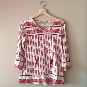 Red and beige patterned shirt
